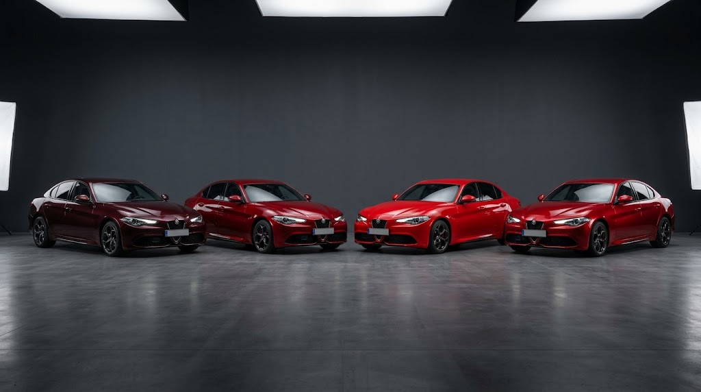 Four red cars showing burgundy, crimson, classic red and candy apple red paint shades